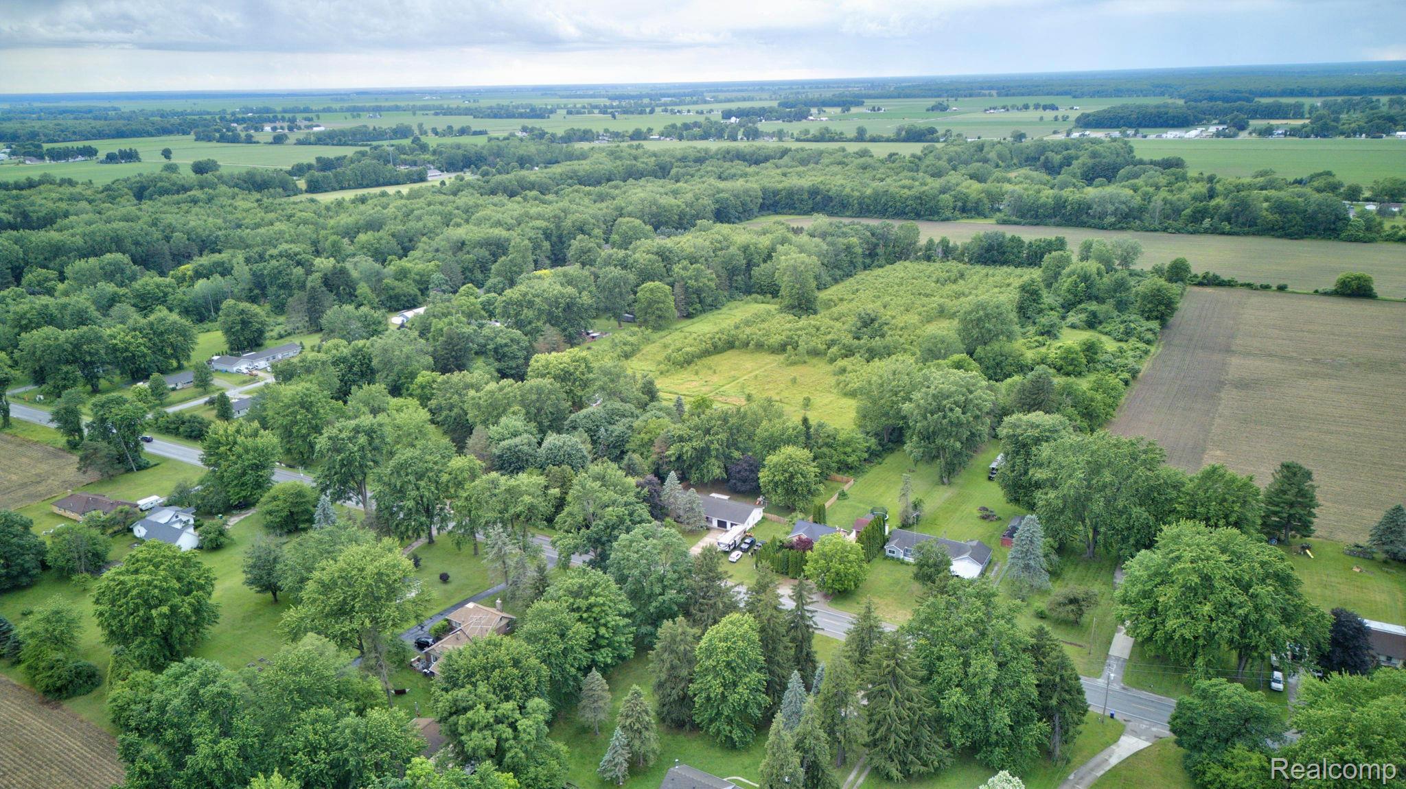 5330 Sheridan Road Saginaw, MI 48601 - Photo 49 of 50 Expansive aerial view showcasing a rural landscape with mature trees and a mix of developed and undeveloped land