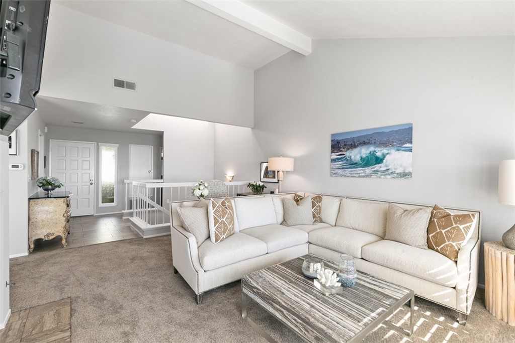 24746 Evening Star Drive, Unit 18 Dana Point, CA 92629 - Photo 11 of 42 a living room with furniture and a couch