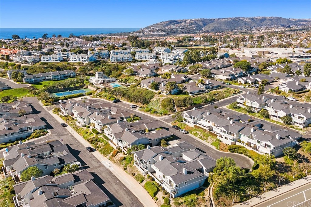 24746 Evening Star Drive, Unit 18 Dana Point, CA 92629 - Photo 40 of 42 an aerial view of residential building with an outdoor space