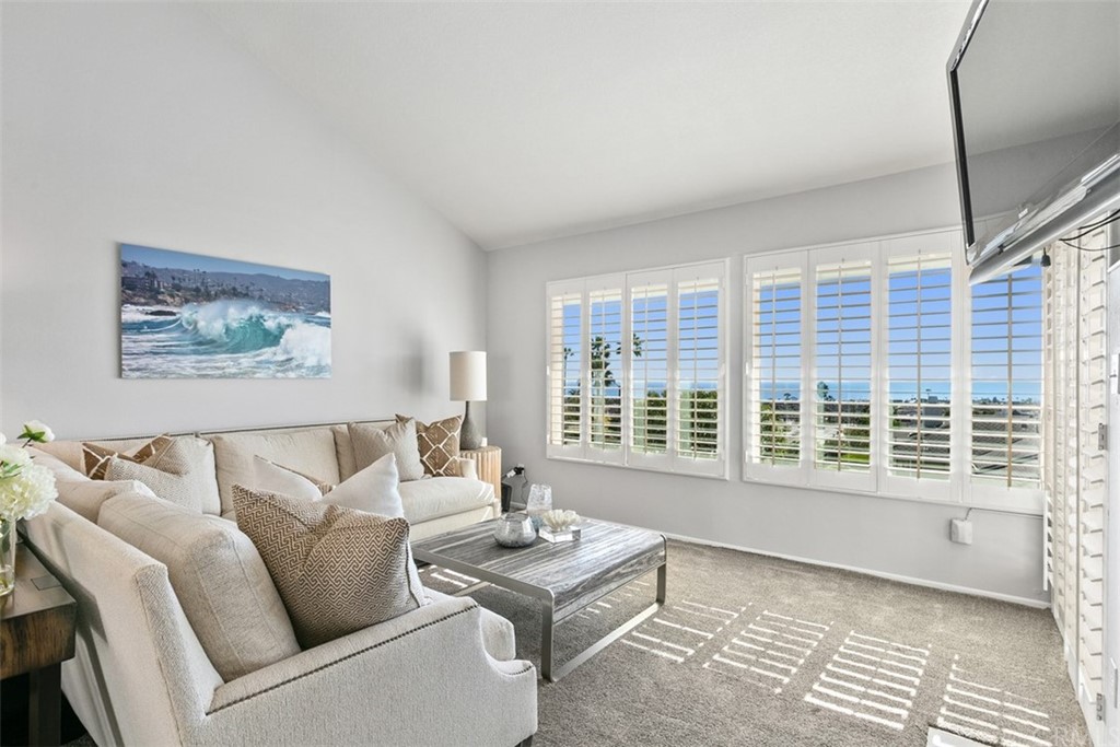 24746 Evening Star Drive, Unit 18 Dana Point, CA 92629 - Photo 5 of 42 a living room with furniture and a window