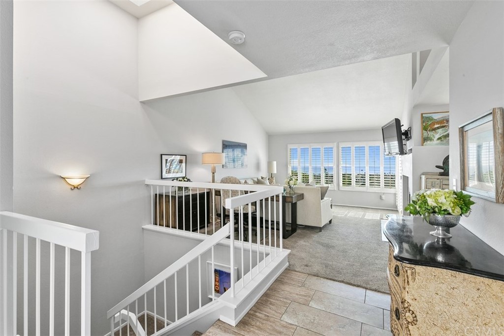 24746 Evening Star Drive, Unit 18 Dana Point, CA 92629 - Photo 9 of 42 a living room with furniture