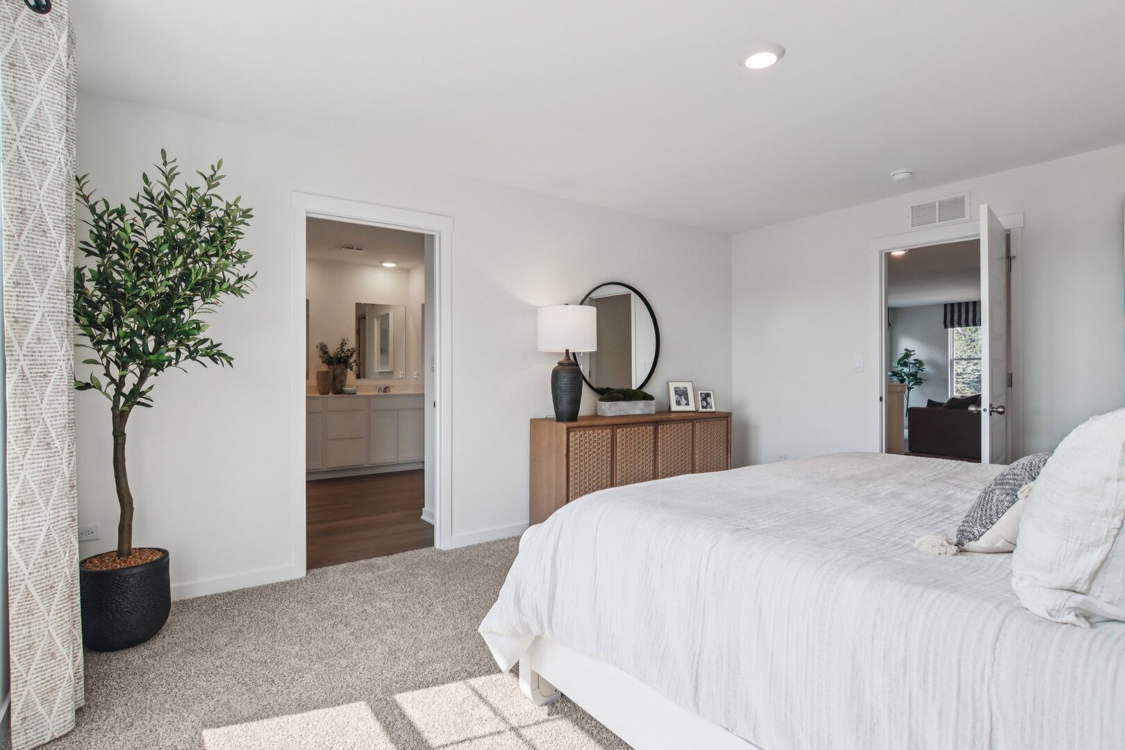 9947 Edgebrook Lane Huntley, IL 60142 - Photo 12 of 64 a bedroom with a bed and a potted plant