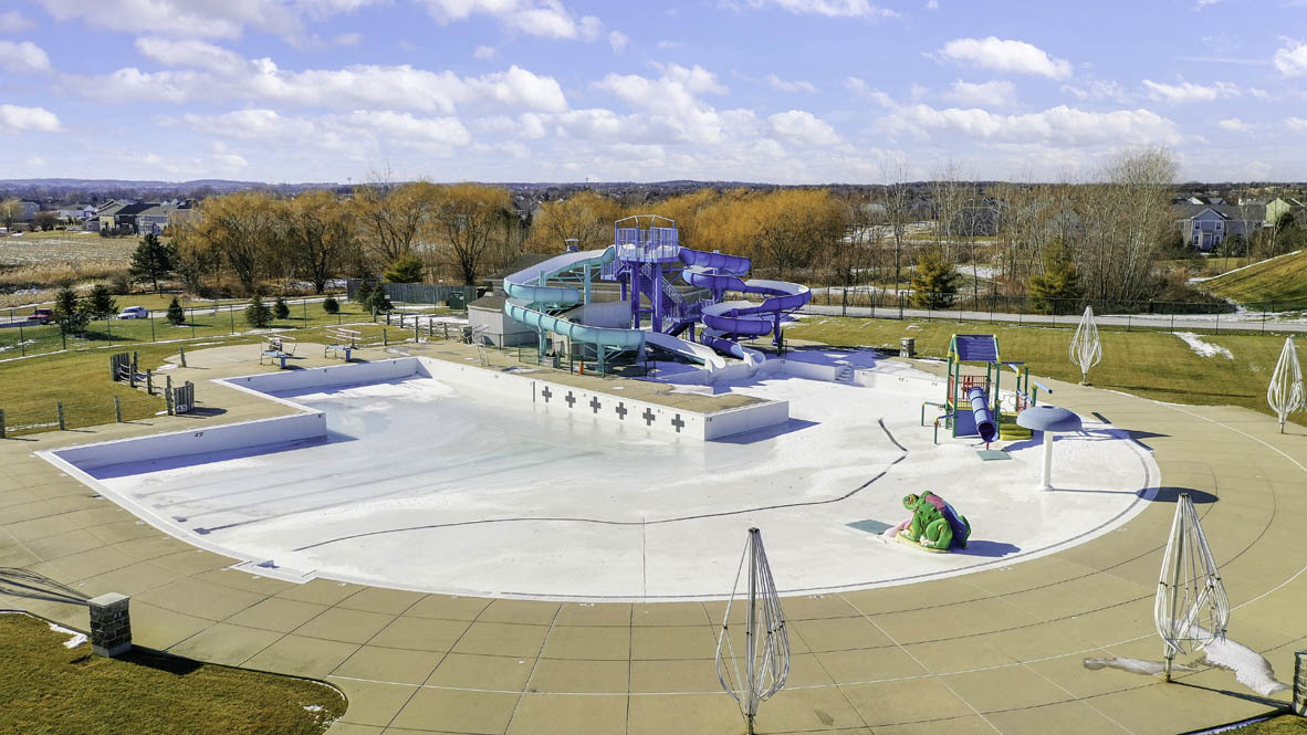 9947 Edgebrook Lane Huntley, IL 60142 - Photo 50 of 64 a view of a swimming pool and an outdoor seating