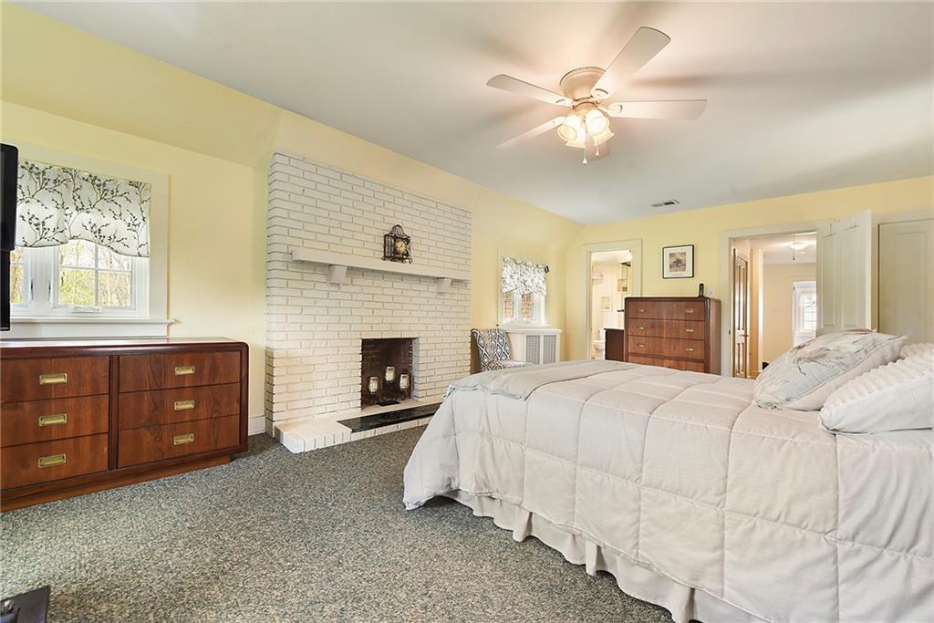 637 East McMurray Road Canonsburg, PA 15317 - Photo 23 of 50 Generous primary suite featuring a cozy fireplace, abundant space, and a peaceful atmosphere for relaxing at the end of the day.