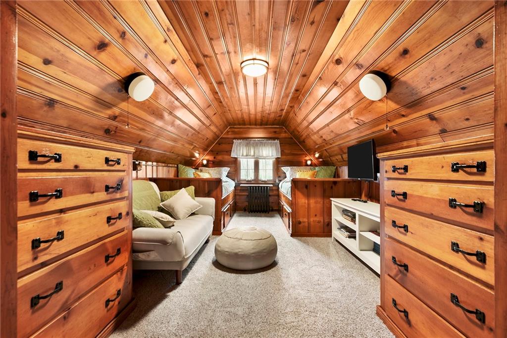 637 East McMurray Road Canonsburg, PA 15317 - Photo 29 of 50 Incredible custom-built bedroom with warm wood finishes, built-in beds, and tons of integrated storage—full of charm and functionality.