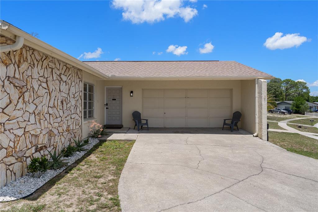 5025 Bromley Avenue Spring Hill, FL 34609 - Photo 2 of 41 a front view of a house with a yard