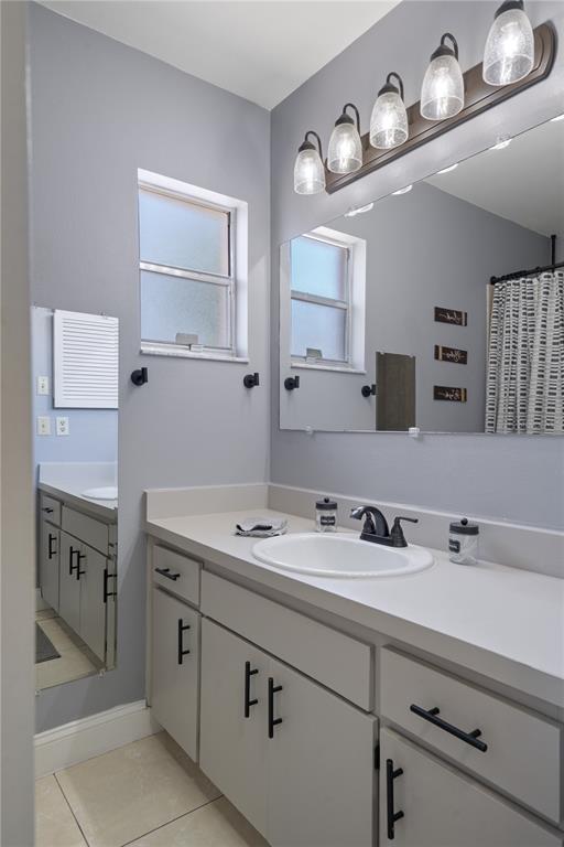 5025 Bromley Avenue Spring Hill, FL 34609 - Photo 23 of 41 a bathroom with a sink and a mirror