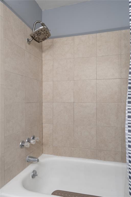 5025 Bromley Avenue Spring Hill, FL 34609 - Photo 24 of 41 a bathroom with a shower and a bathtub