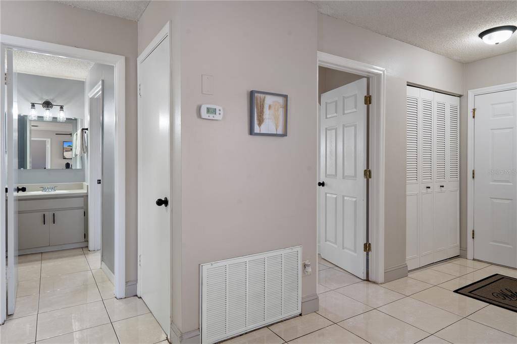 5025 Bromley Avenue Spring Hill, FL 34609 - Photo 25 of 41 a view of a hallway with closet and bathroom