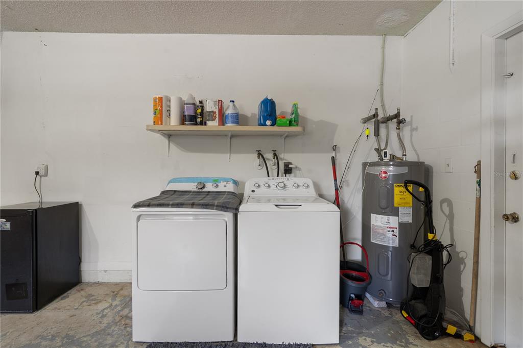 5025 Bromley Avenue Spring Hill, FL 34609 - Photo 35 of 41 a utility room with dryer and washer