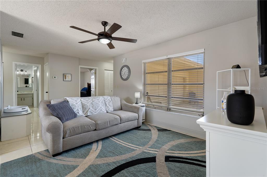 5025 Bromley Avenue Spring Hill, FL 34609 - Photo 8 of 41 a living room with furniture and a window
