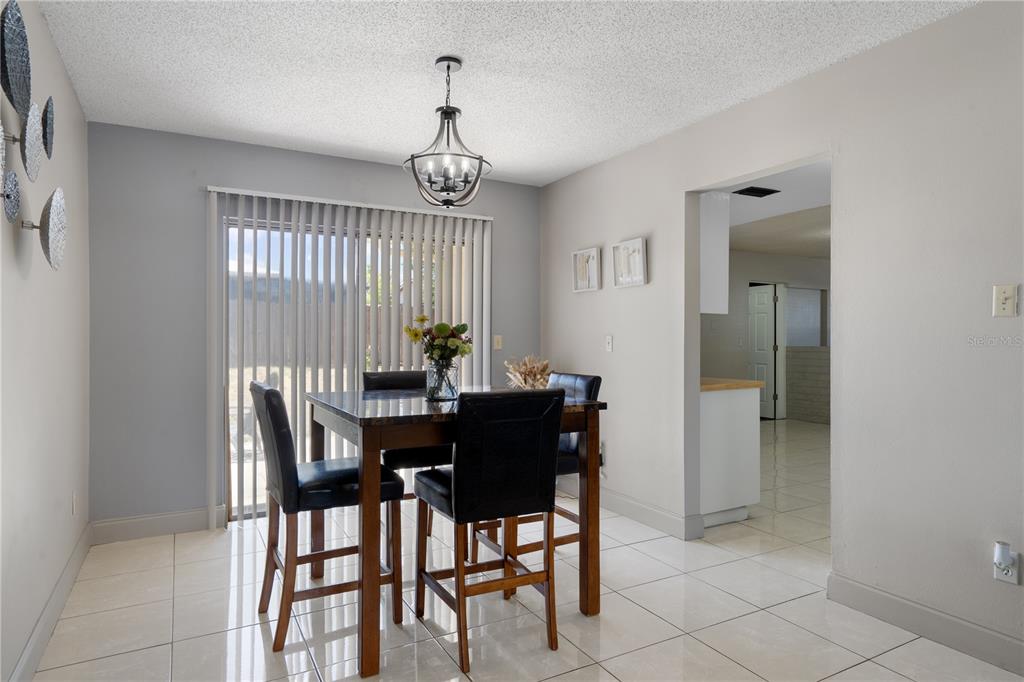 5025 Bromley Avenue Spring Hill, FL 34609 - Photo 10 of 41 a view of a dining room with furniture