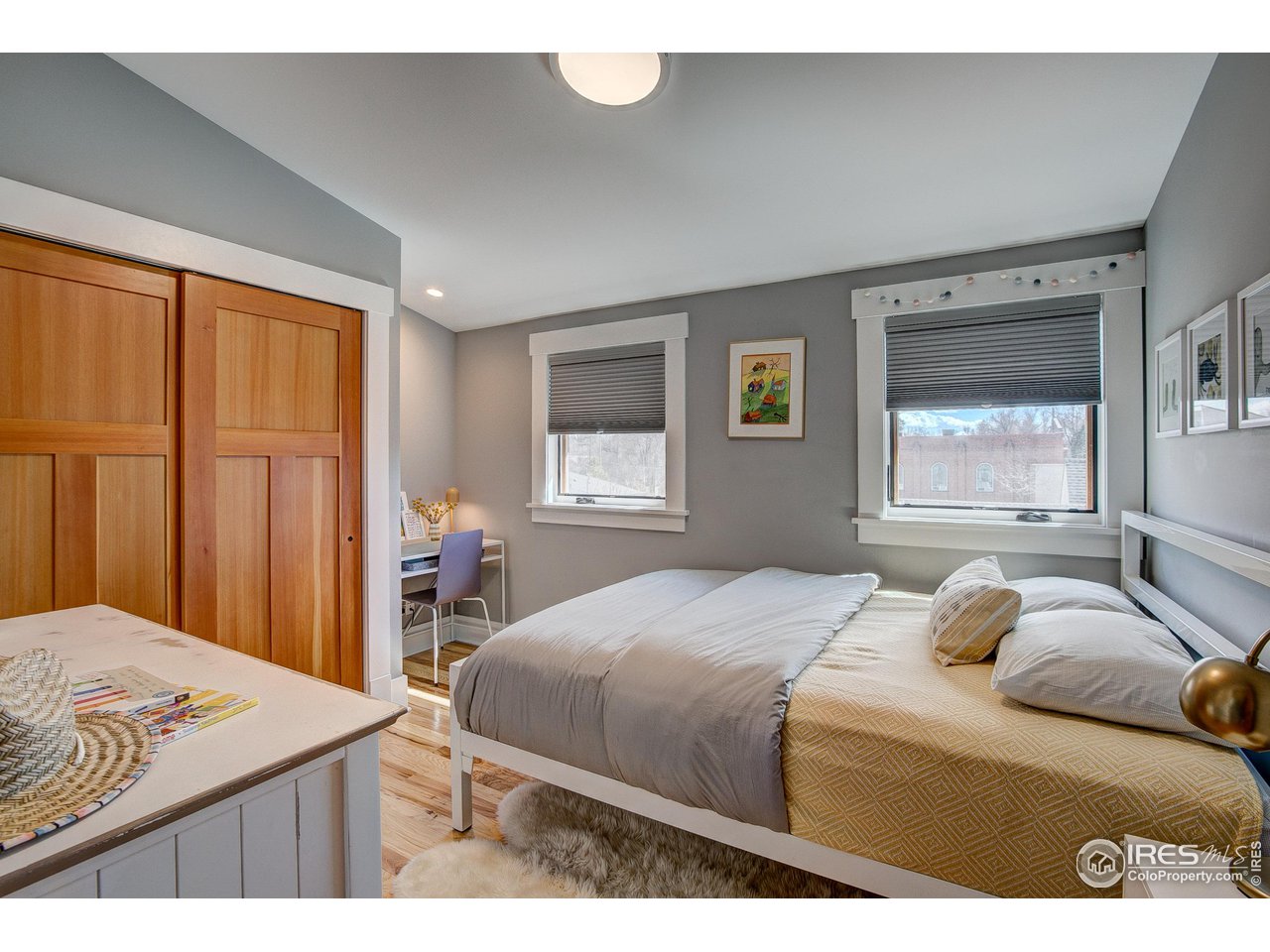 406 North Whitcomb Street Fort Collins, CO 80521 - Photo 15 of 33 a bedroom with a bed and a window