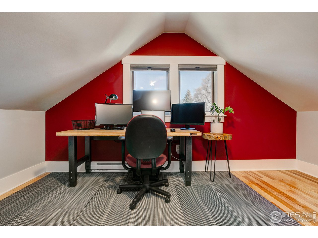406 North Whitcomb Street Fort Collins, CO 80521 - Photo 19 of 33 a workspace with furniture window and wooden floor
