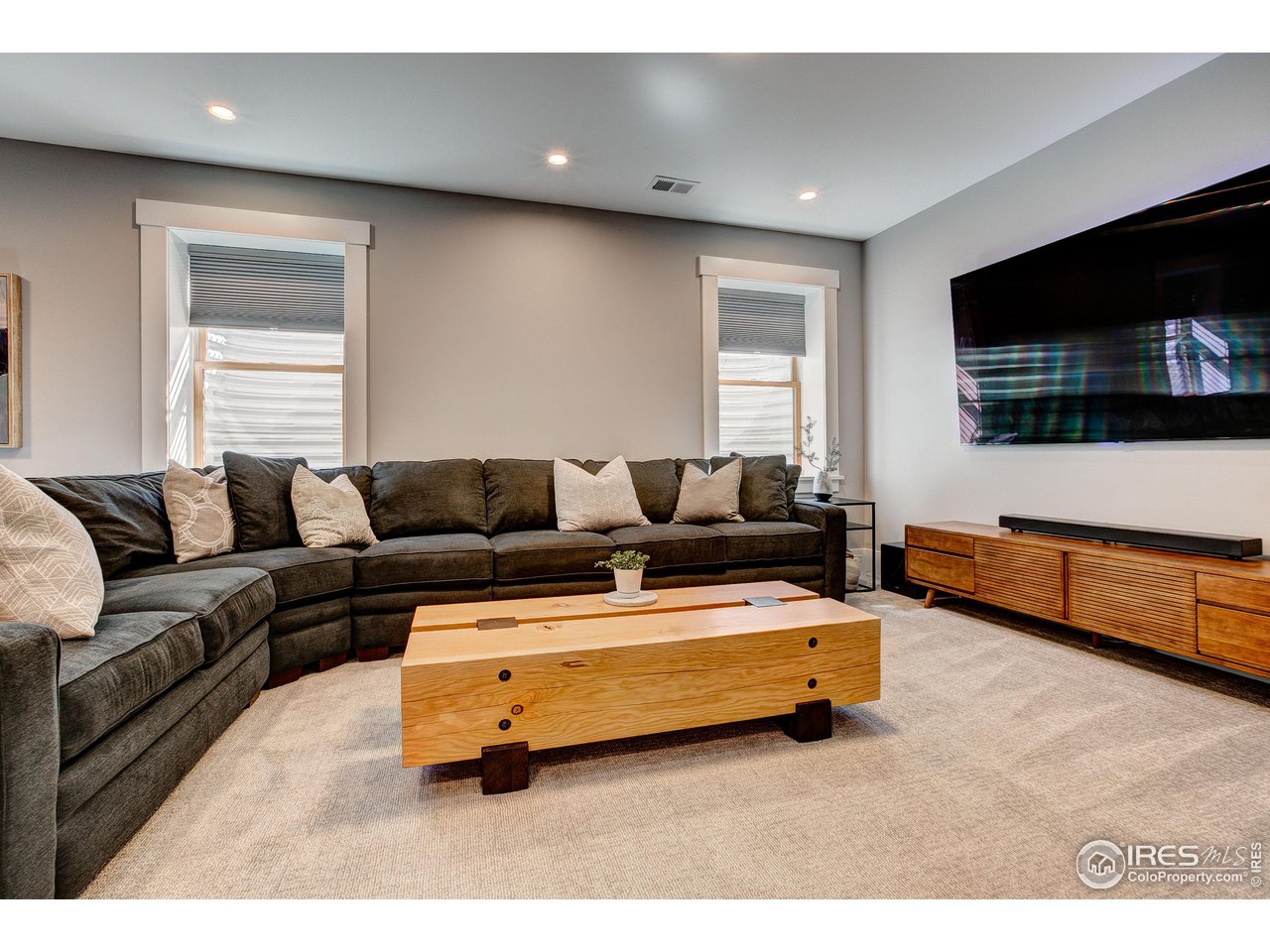 406 North Whitcomb Street Fort Collins, CO 80521 - Photo 22 of 33 a living room with furniture and a flat screen tv