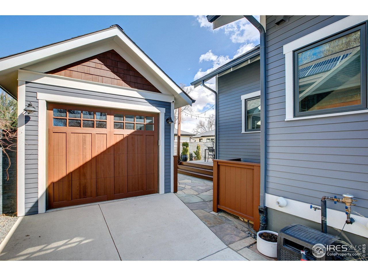 406 North Whitcomb Street Fort Collins, CO 80521 - Photo 29 of 33 a view of a house with a door and wooden walls