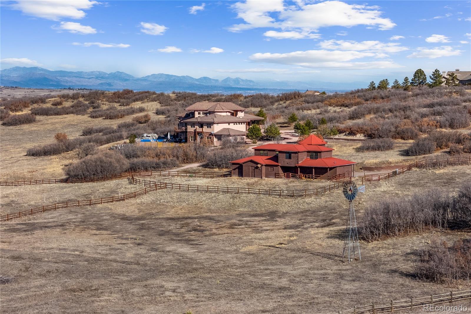 an aerial view of a houses with a yard