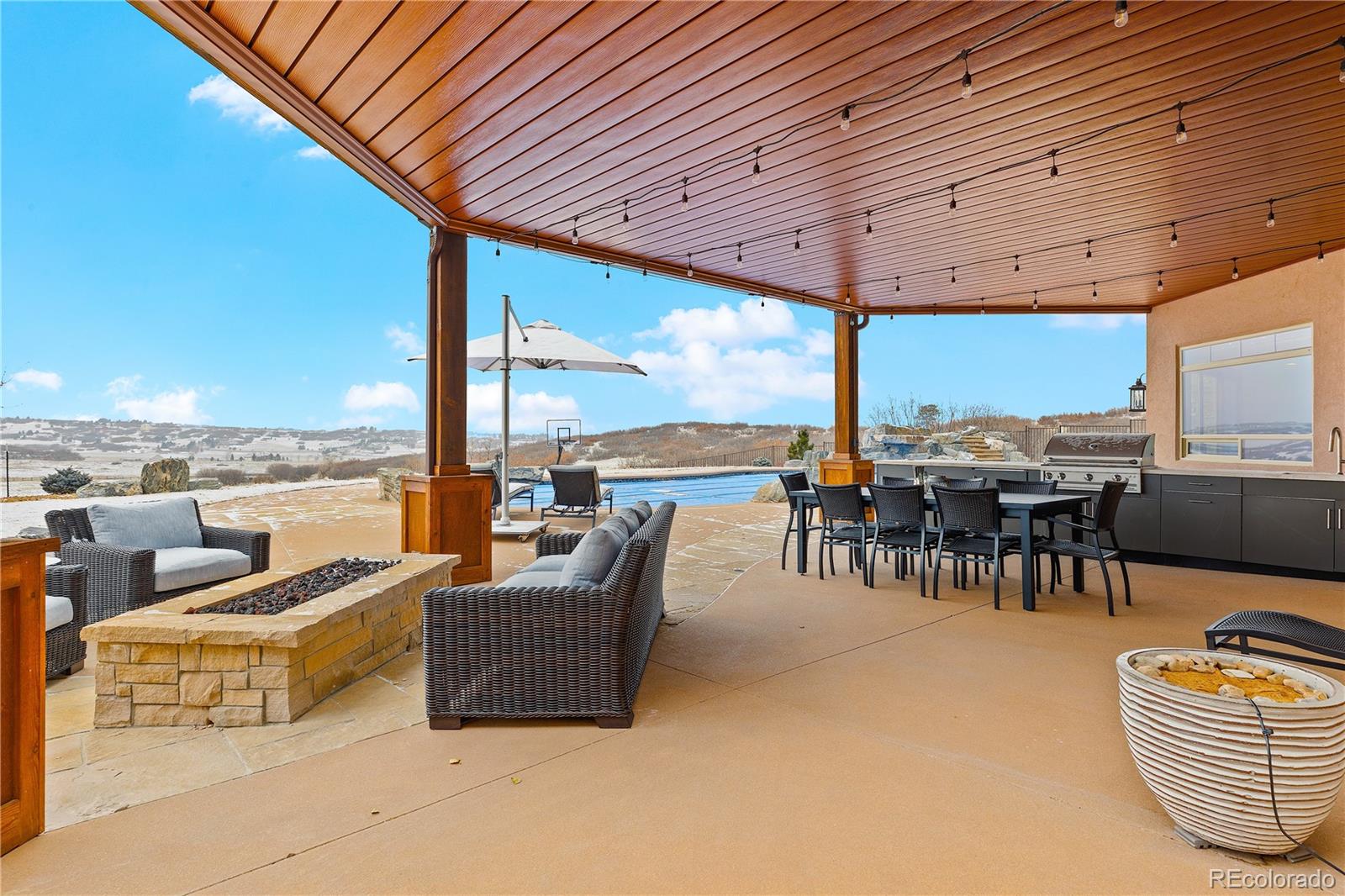 2505 Big Bear Circle Sedalia, CO 80135 - Photo 41 of 49 a outdoor space with patio furniture and ocean view