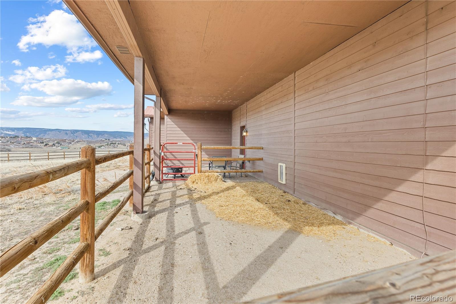 2505 Big Bear Circle Sedalia, CO 80135 - Photo 45 of 49 a view of balcony with wooden floor