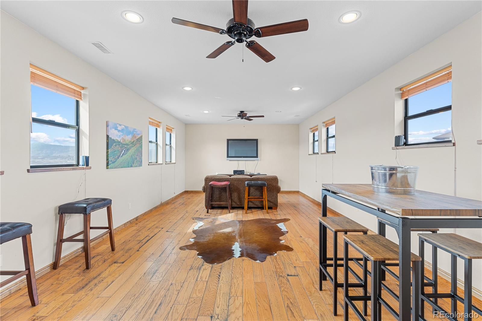 2505 Big Bear Circle Sedalia, CO 80135 - Photo 48 of 49 a living room with furniture and a wooden floor