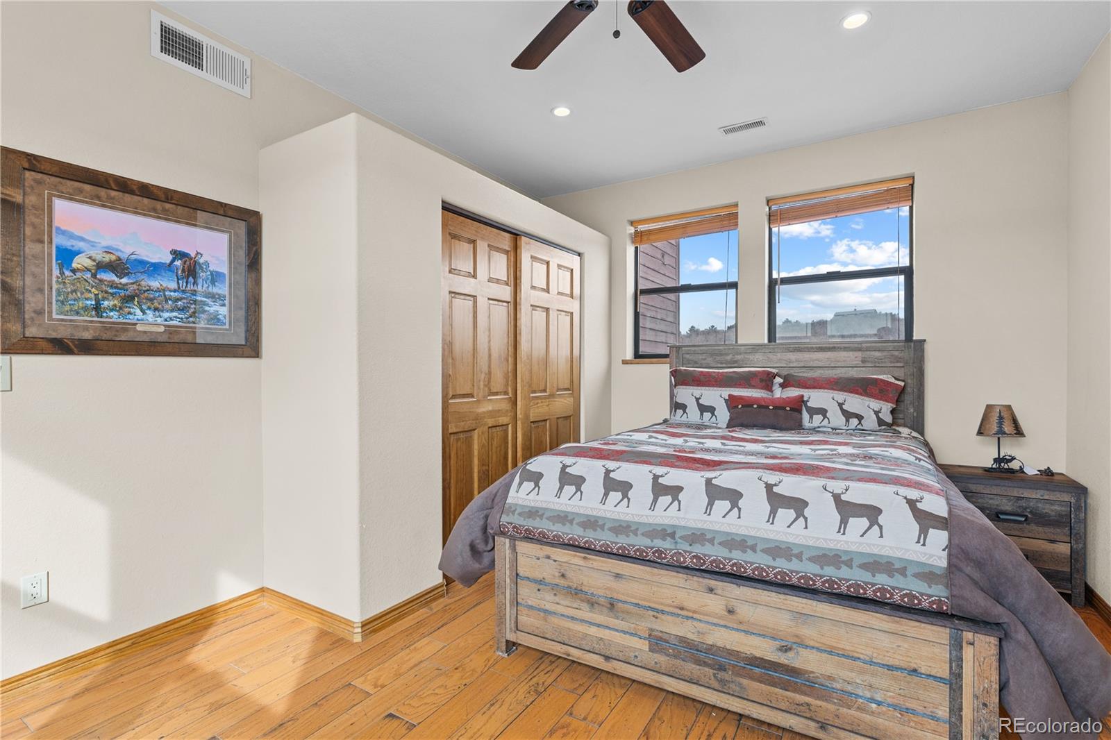 2505 Big Bear Circle Sedalia, CO 80135 - Photo 49 of 49 a bedroom with a bed and a painting on the wall