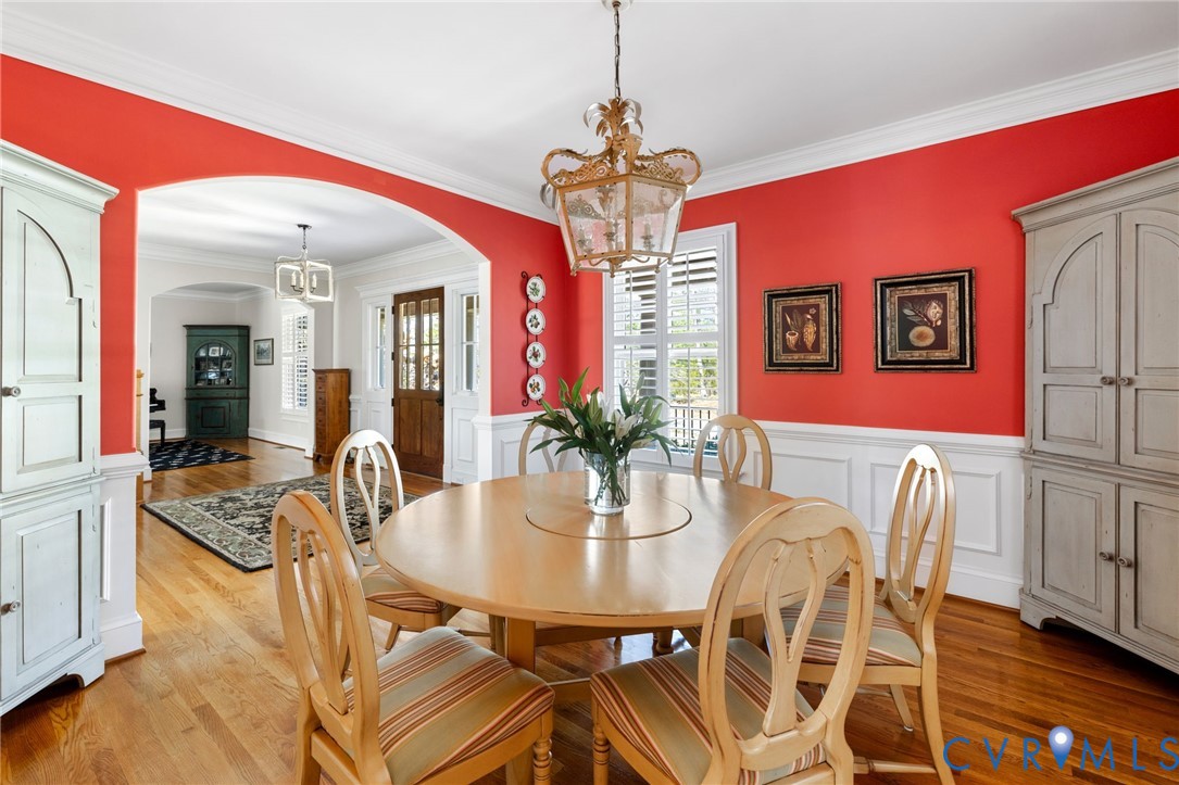 8947 Cherokee Road Richmond, VA 23235 - Photo 9 of 45 a view of a dining room with furniture and wooden floor