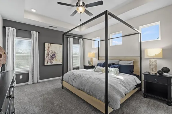a bedroom with a large bed and a window