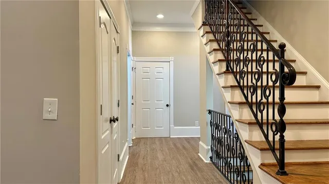 a view of an empty room with window and cabinet