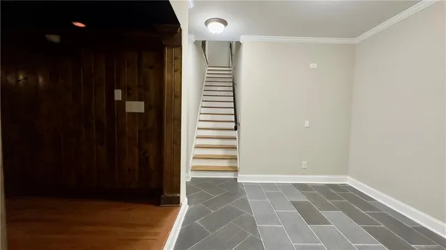 a view of a white house with a yard and plants