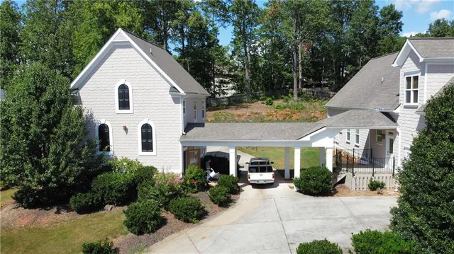 a view of a lake with trees in the background