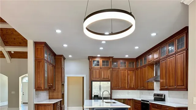 a view of a kitchen with a large window
