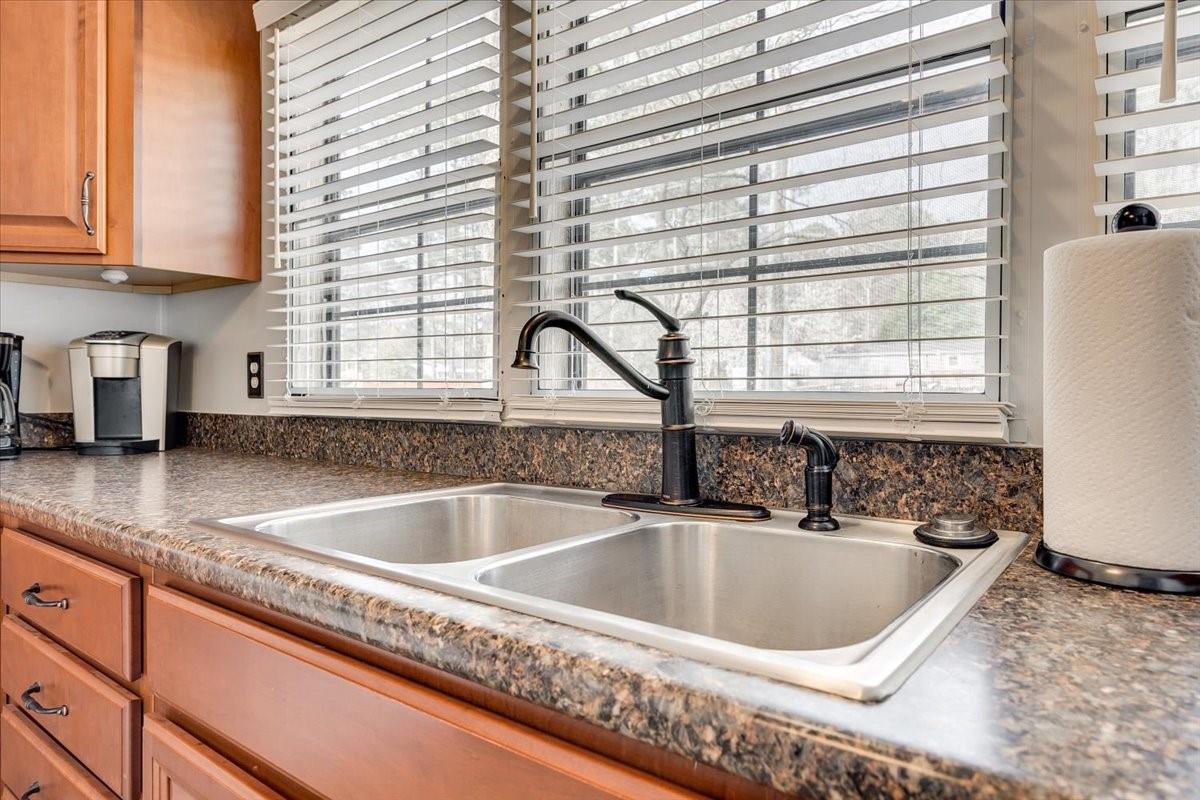 1230 Stateline Road Lake Wylie, SC 29710 - Photo 11 of 25 a kitchen with a granite countertop sink and a window