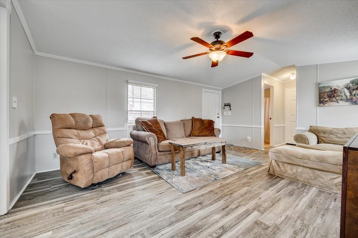 1230 Stateline Road Lake Wylie, SC 29710 - Photo 5 of 25 a living room with furniture and a chandelier