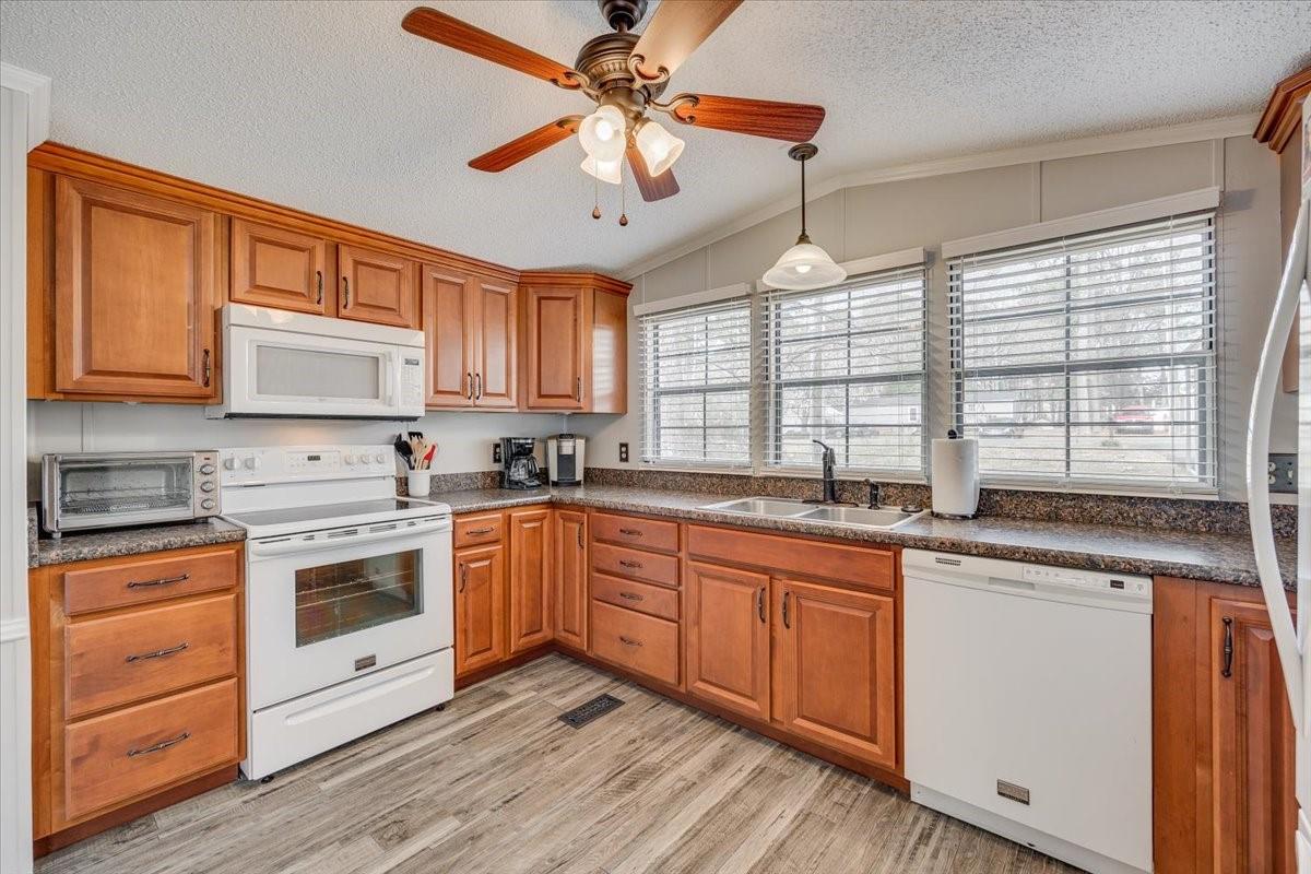 1230 Stateline Road Lake Wylie, SC 29710 - Photo 9 of 25 a kitchen with stainless steel appliances granite countertop a stove sink and cabinets