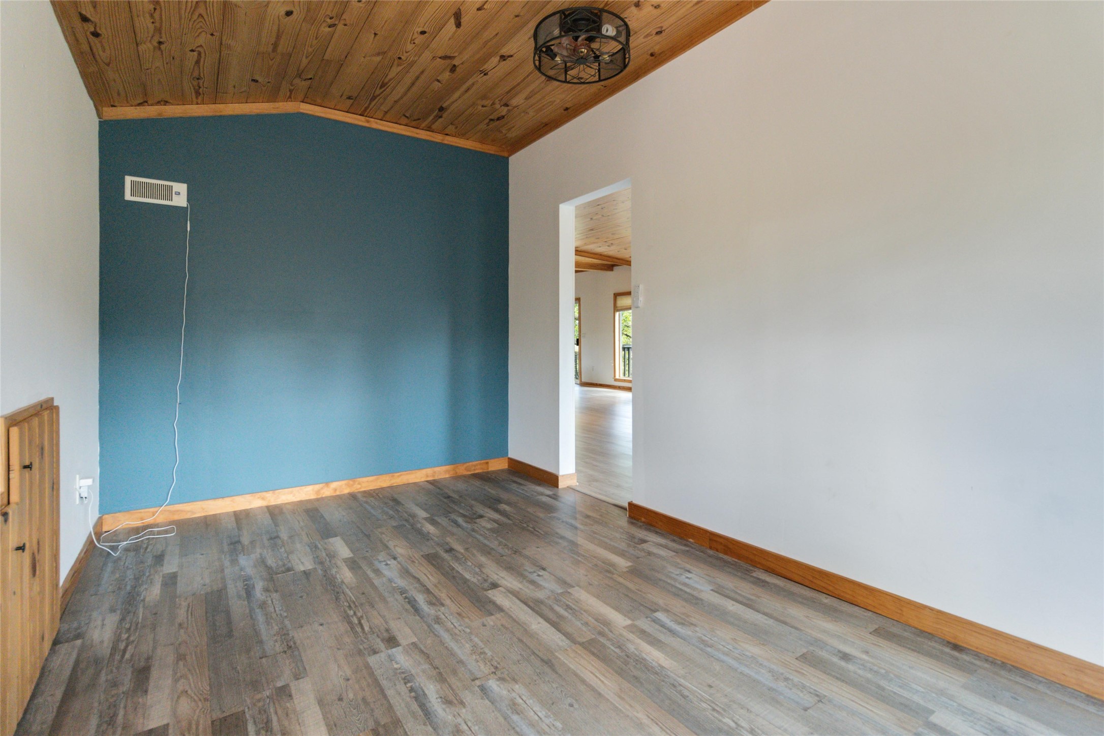 180 Ironstone Road Smithville, TX 78957 - Photo 21 of 37 Empty room with a vaulted wooden ceiling and wood finished floors
