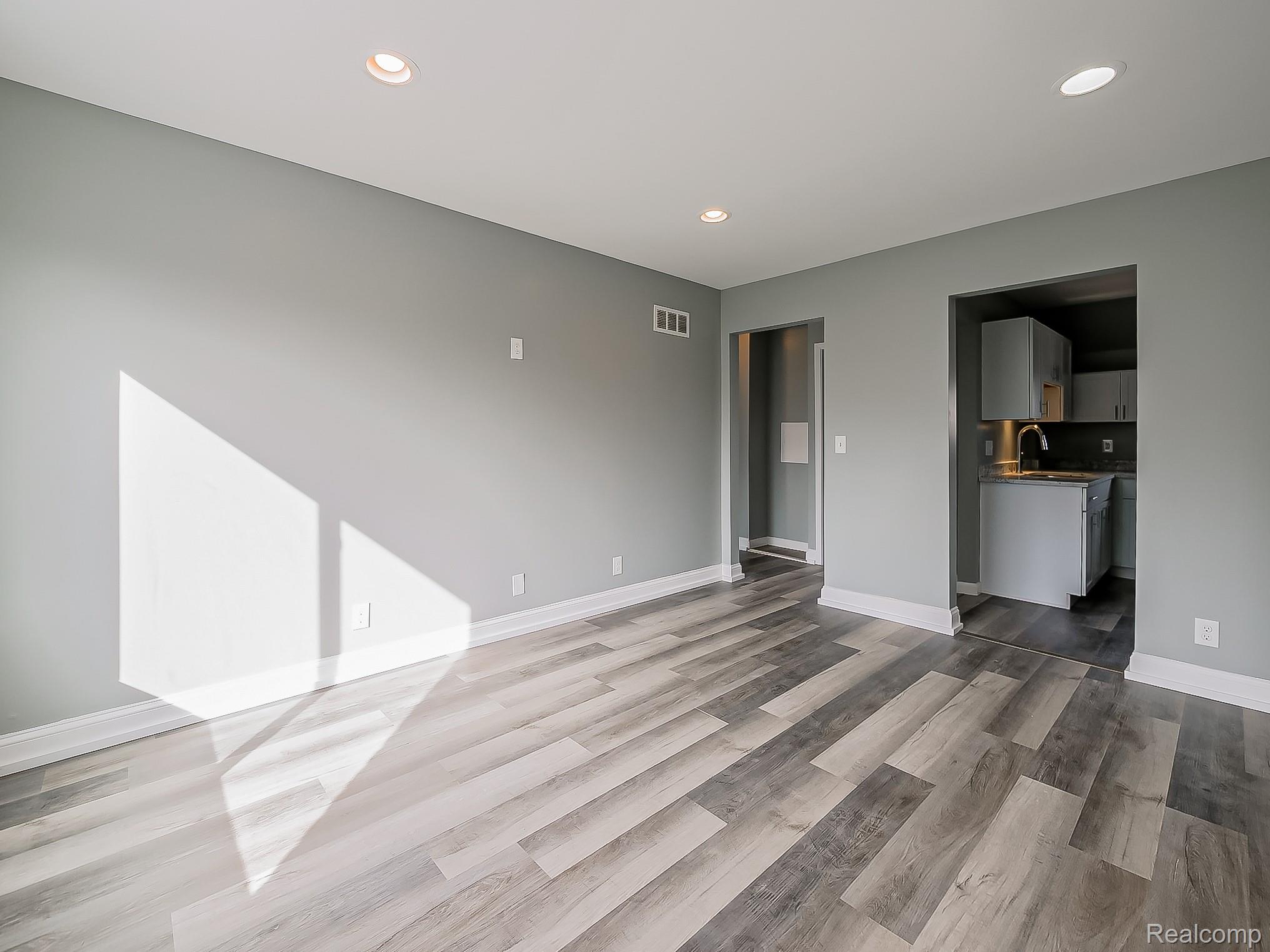 13 Mohawk Road Pontiac, MI 48341 - Photo 6 of 24 Unfurnished living room featuring recessed lighting and light wood-style flooring