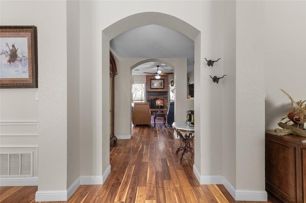 1007 Santa Fe Street Denton, TX 76205 - Photo 3 of 37 a view of a hallway view with wooden floor and furniture