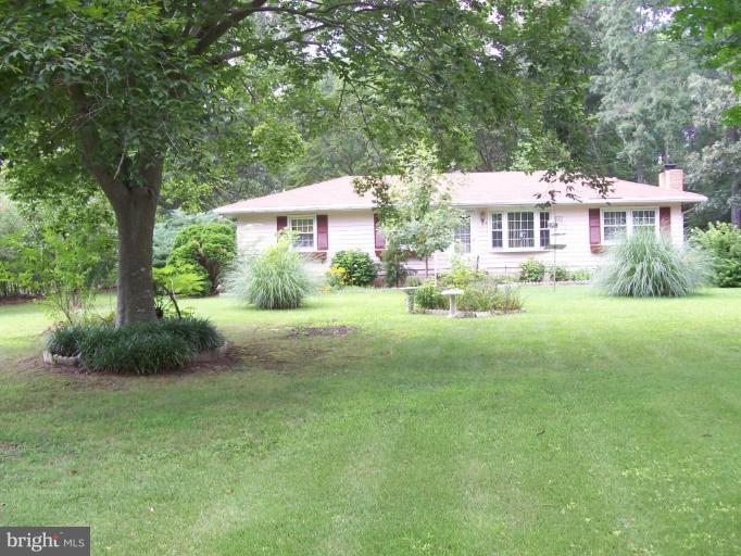 48420 Mattapany Road Lexington Park, MD 20653 - Photo 1 of 7 a front view of a house with a yard