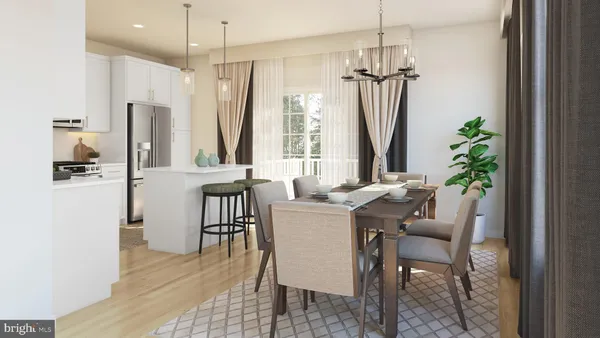 a dining room with furniture potted plants and wooden floor
