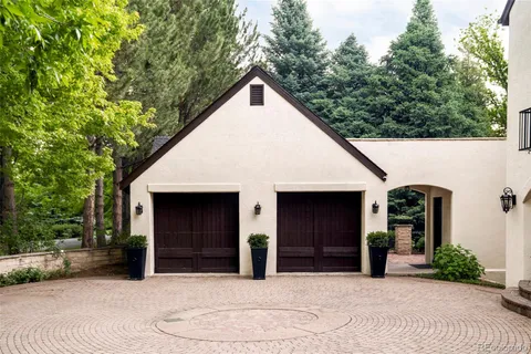 a view of a house with a yard and garage