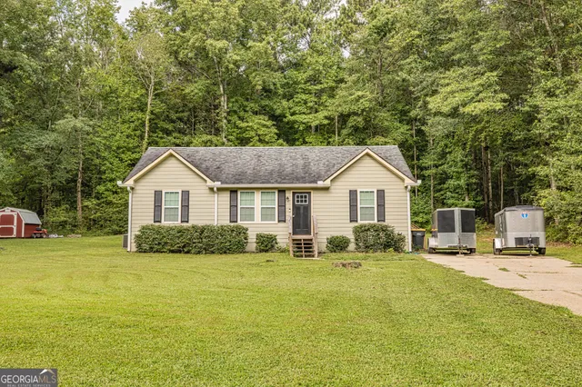 a front view of a house with a yard