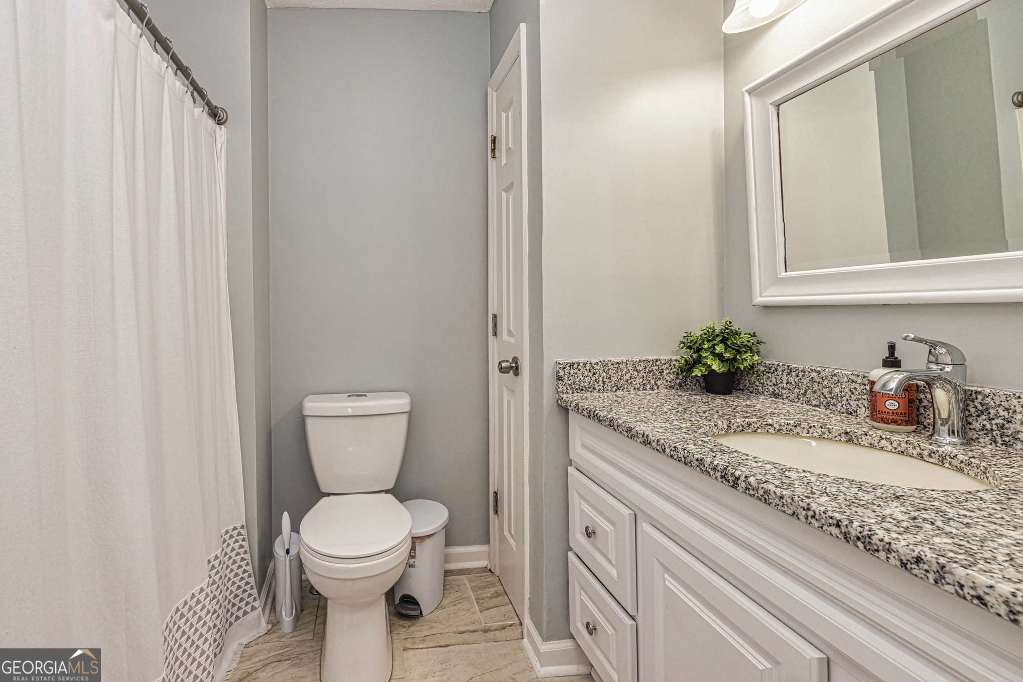 80 Prestigious Place Senoia, GA 30276 - Photo 17 of 19 a bathroom with a granite countertop sink and a toilet