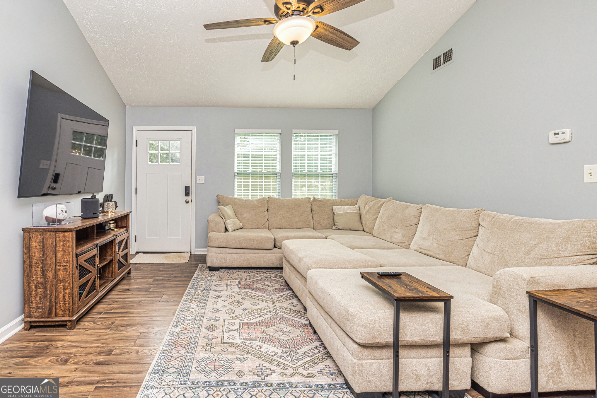 80 Prestigious Place Senoia, GA 30276 - Photo 6 of 19 a living room with furniture and a flat screen tv
