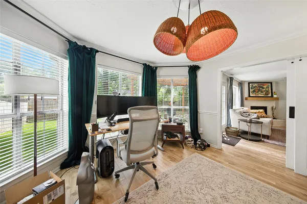 a view of a livingroom with furniture and a large window