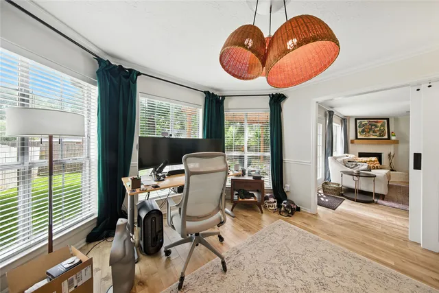 a view of a livingroom with furniture and a large window