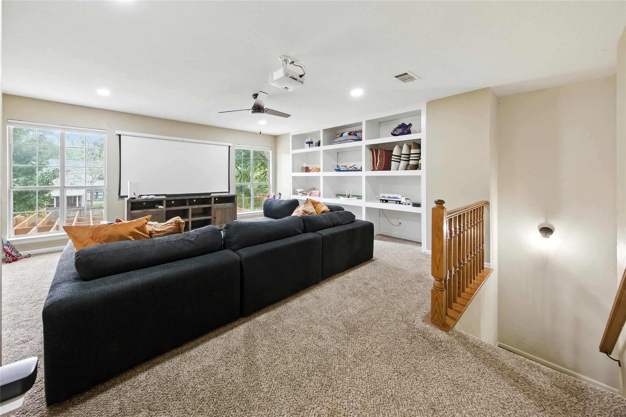 115 Regency Way Conroe, TX 77304 - Photo 22 of 32 a living room with furniture and a flat screen tv