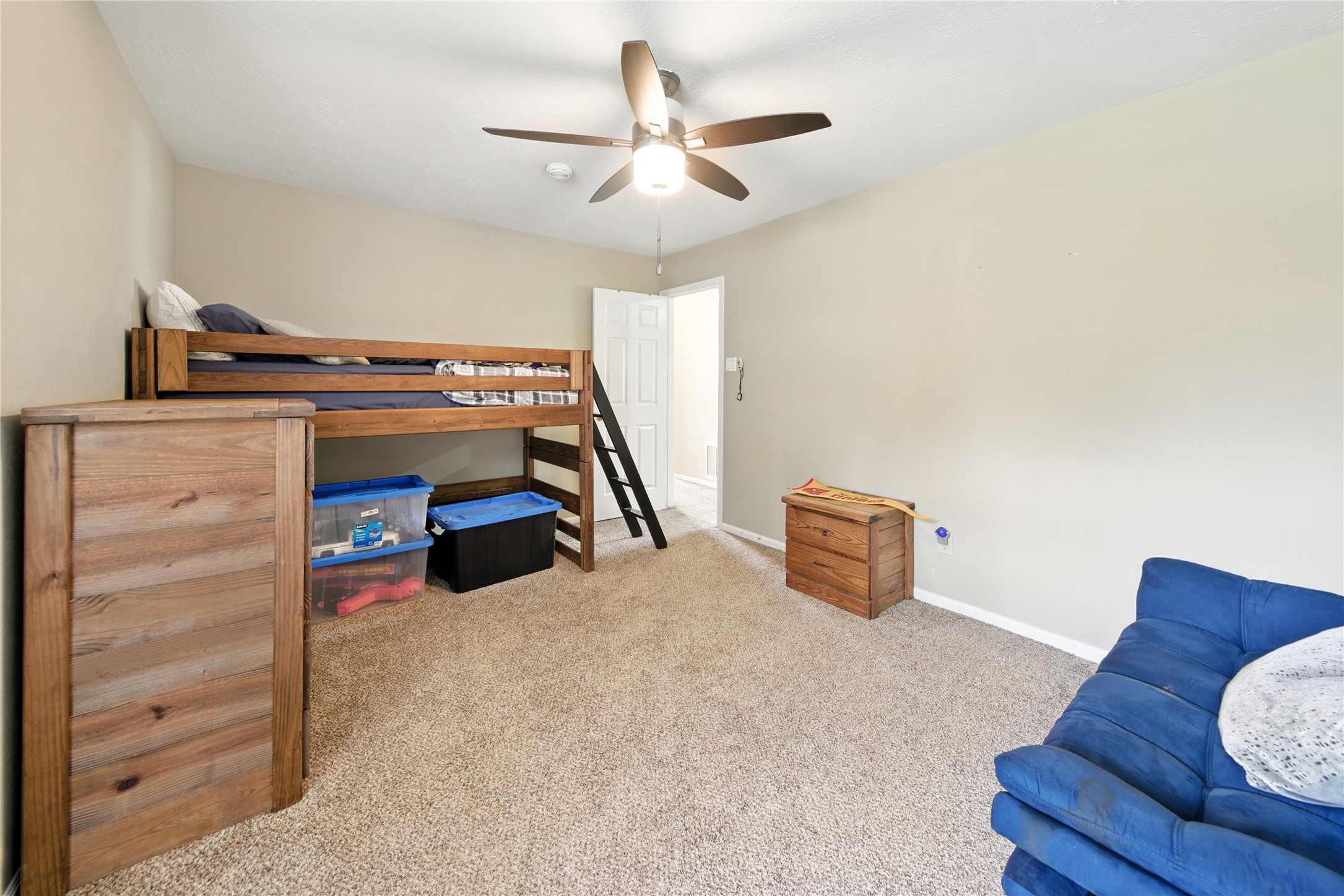 115 Regency Way Conroe, TX 77304 - Photo 24 of 32 a bedroom with furniture and a ceiling fan