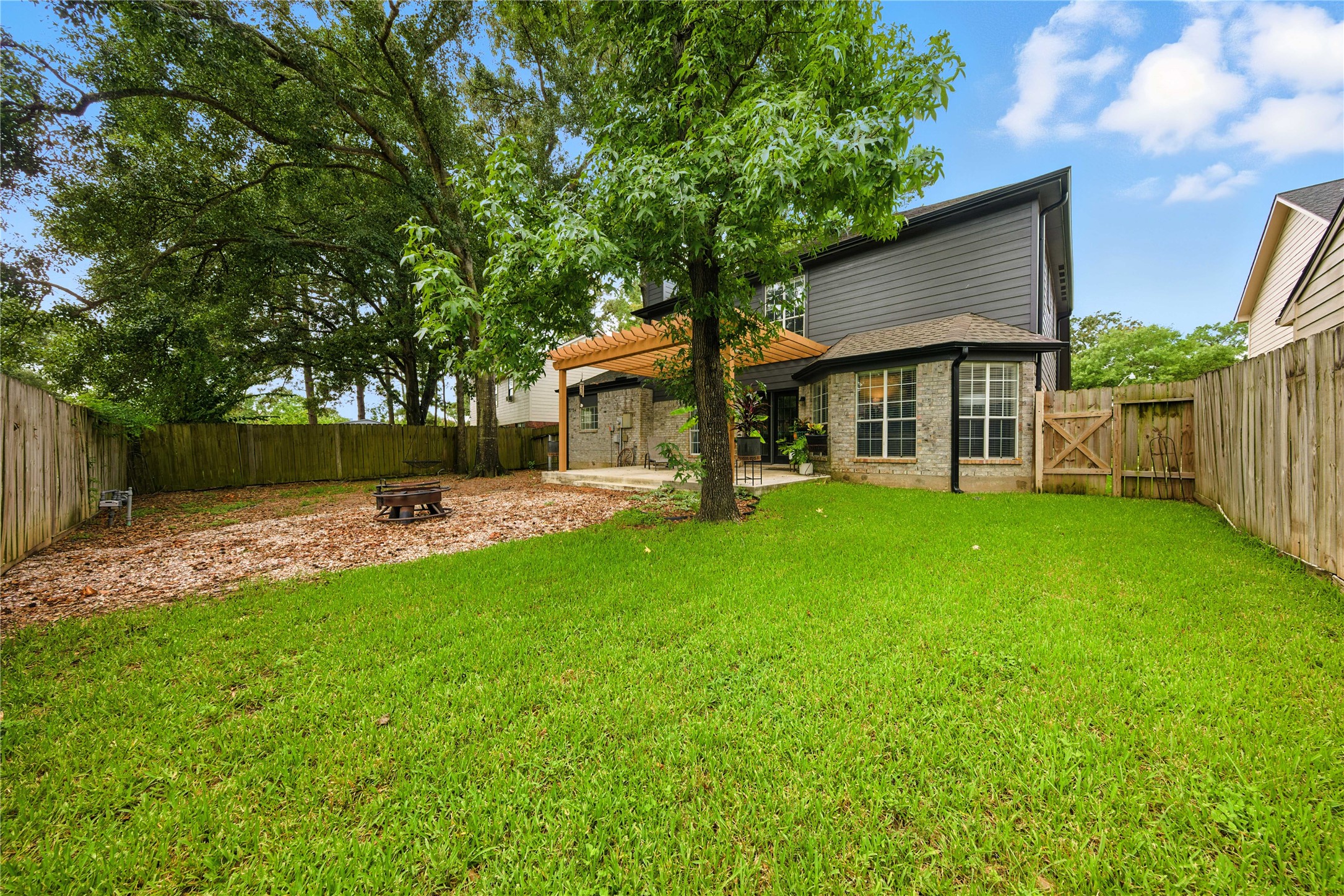 115 Regency Way Conroe, TX 77304 - Photo 31 of 32 a front view of house with yard and green space