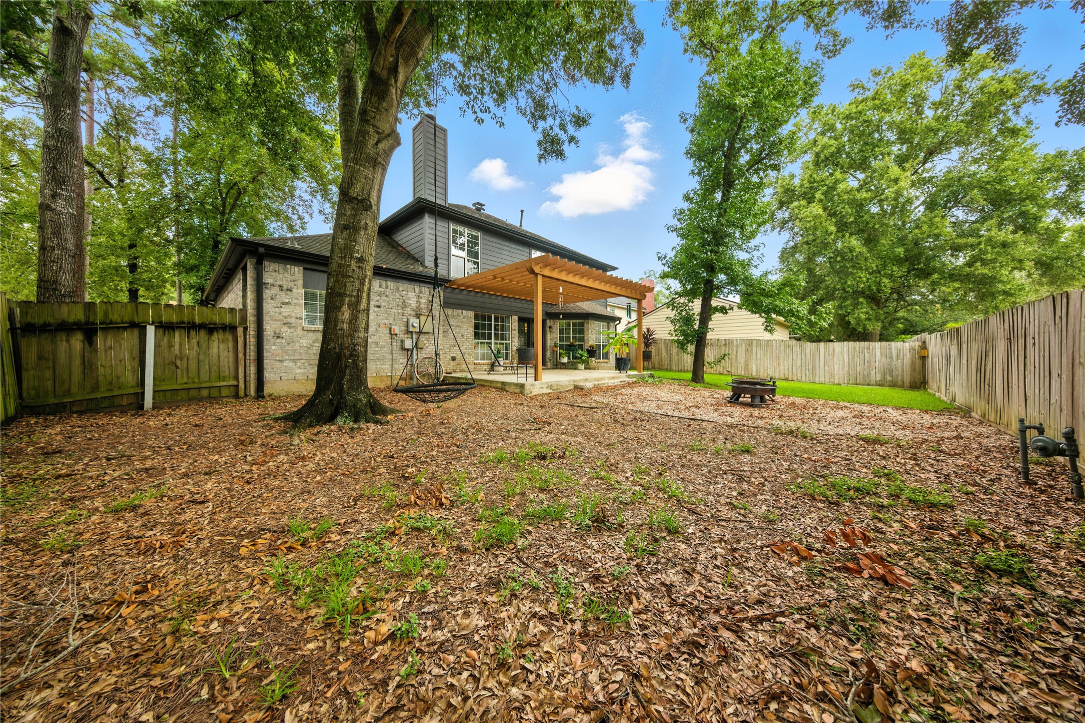115 Regency Way Conroe, TX 77304 - Photo 32 of 32 a front view of a house with a yard