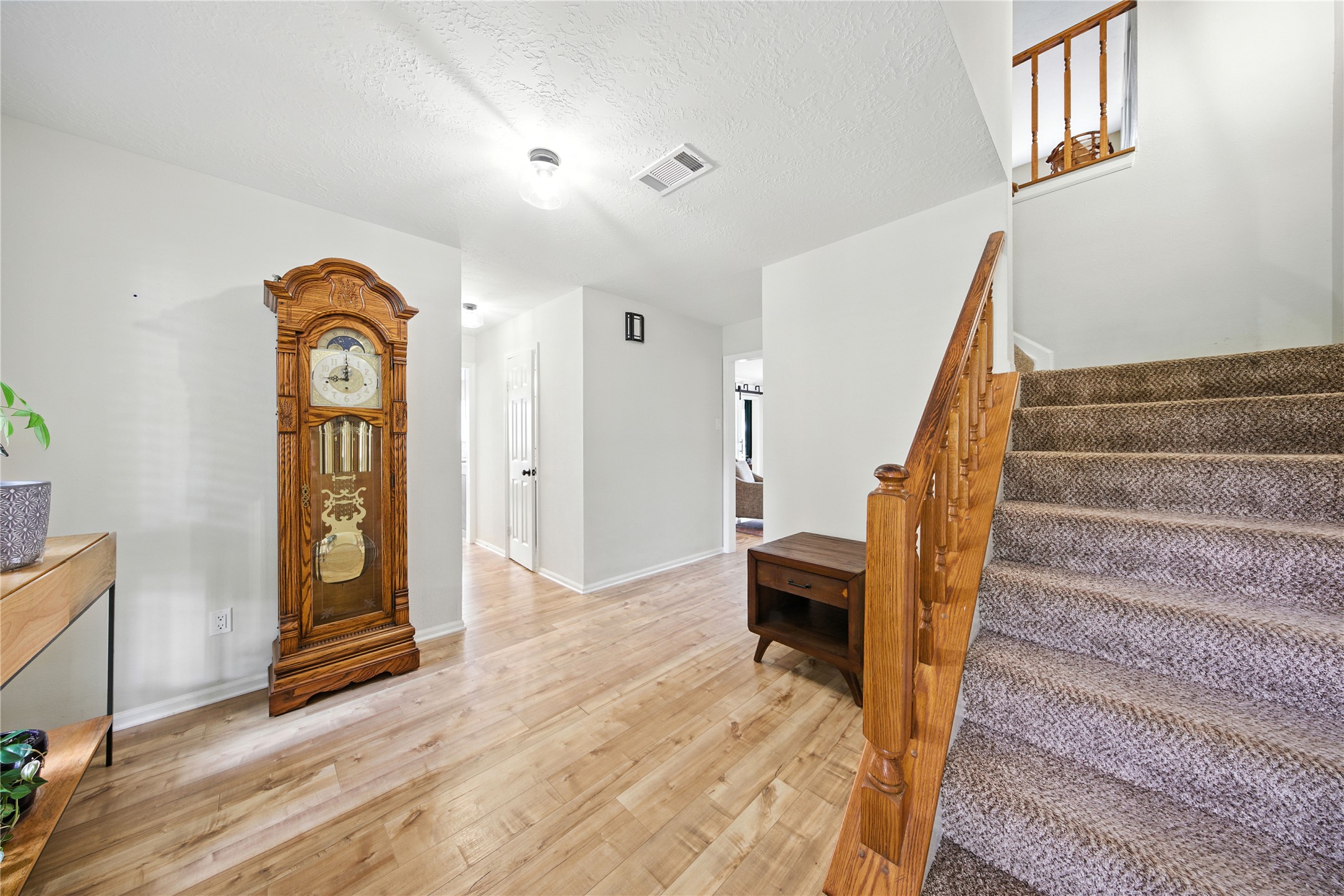 115 Regency Way Conroe, TX 77304 - Photo 4 of 32 a view of an entryway with wooden floor